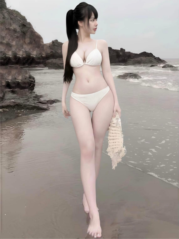 Ảnh cô giáo Hương vú to sexy bên biển