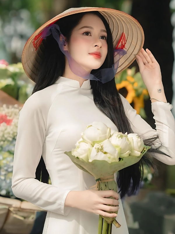 Gái xinh mặc áo dài trắng cầm hoa sen